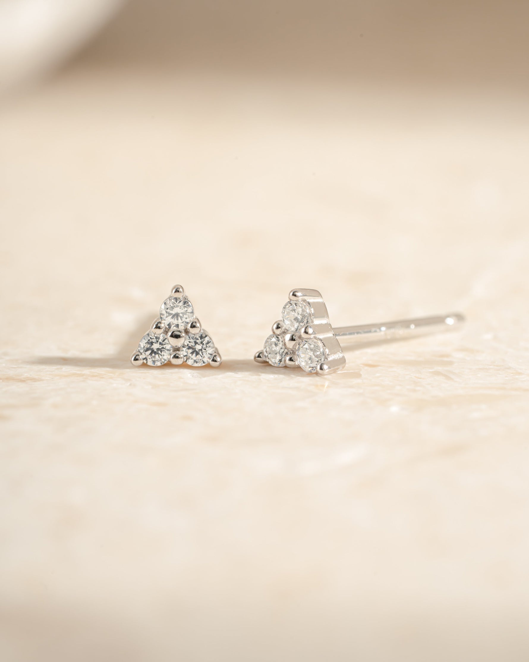 Sterling silver Tiny CZ 3 Stone Stud Earrings by Sami Jewels featuring sparkling cubic zirconia stones.