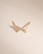 Sami Jewels three-stone cubic zirconia stud earrings with gold setting, top view showing sparkling stones and classic design.