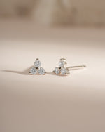 Sterling silver three-stone CZ stud earrings by Sami Jewels featuring sparkling cubic zirconia stones.