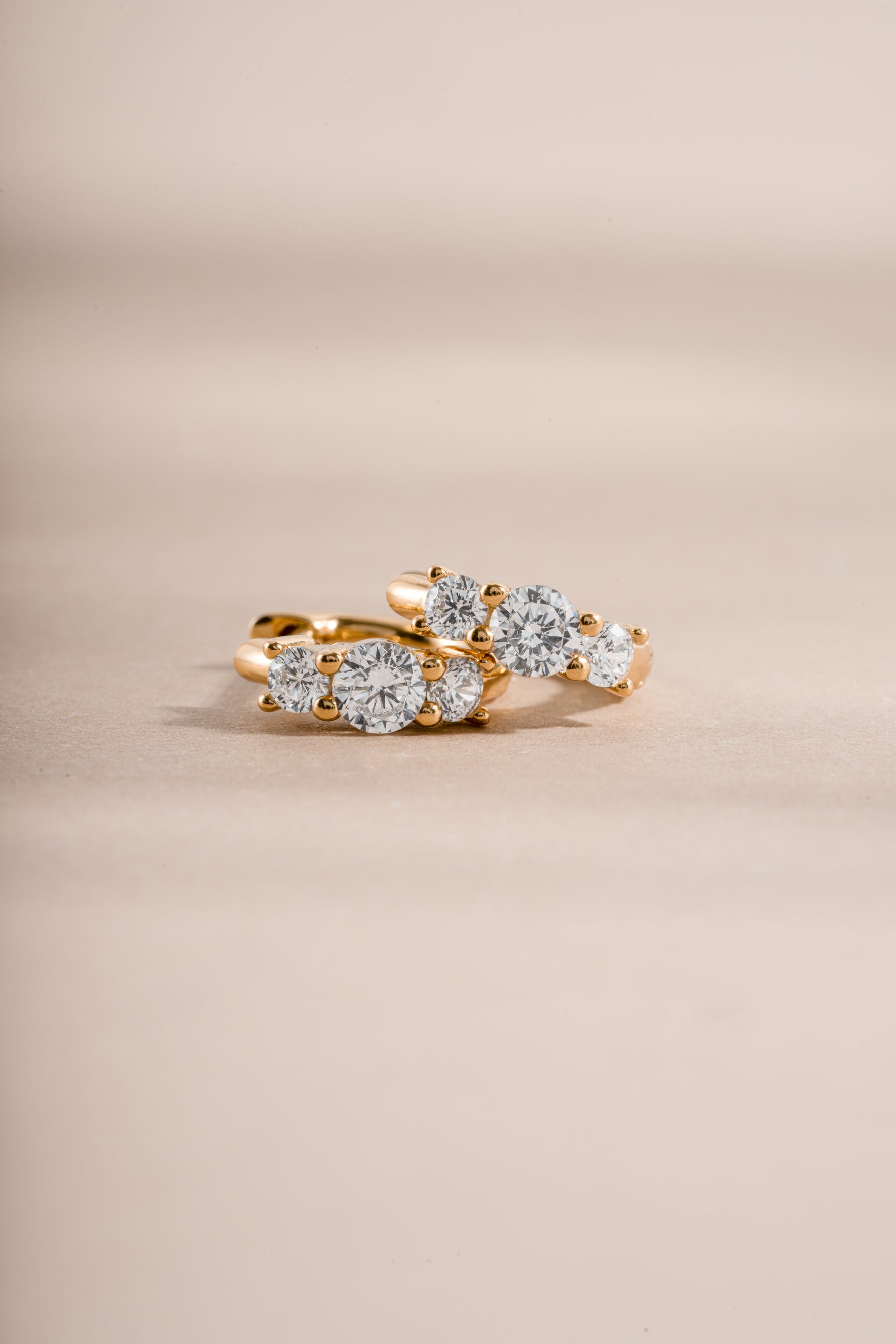 gold three stone huggie earring