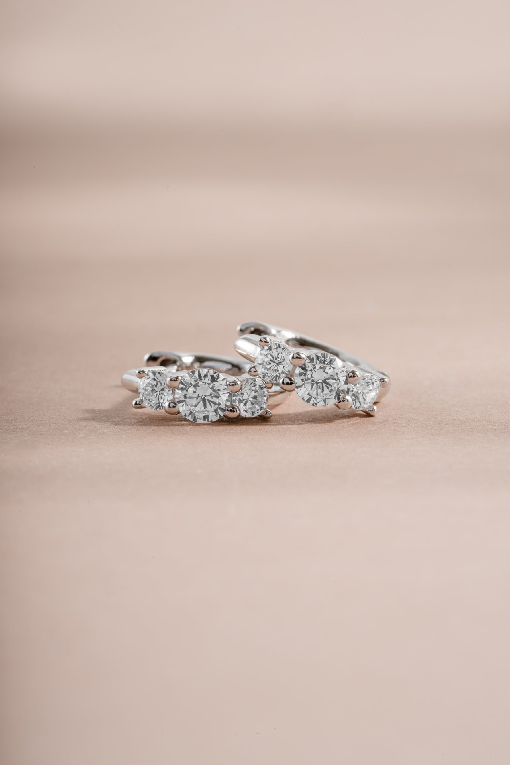 sterling silver three stone huggie earring