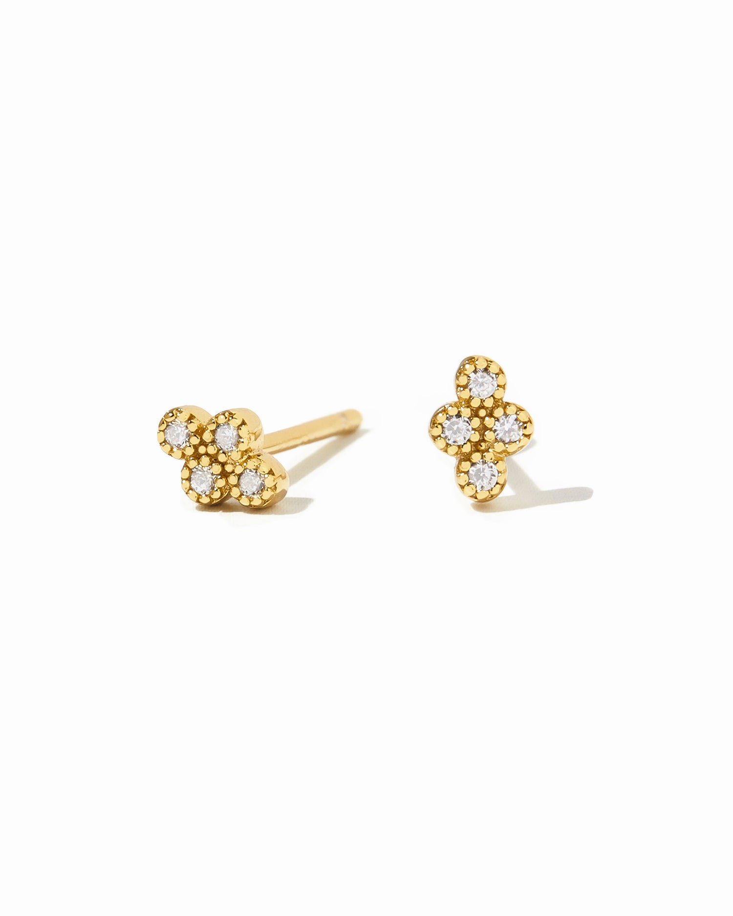 Gold tiny 4-stone cubic zirconia stud earrings by Sami Jewels on a white background.