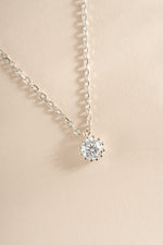 Close-up of Sami Jewels tiny bezel pendant necklace in sterling silver, showcasing the delicate pendant design.