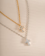 Sterling silver and gold tiny cross pendant necklace from Sami Jewels, featuring a delicate and minimalist design.