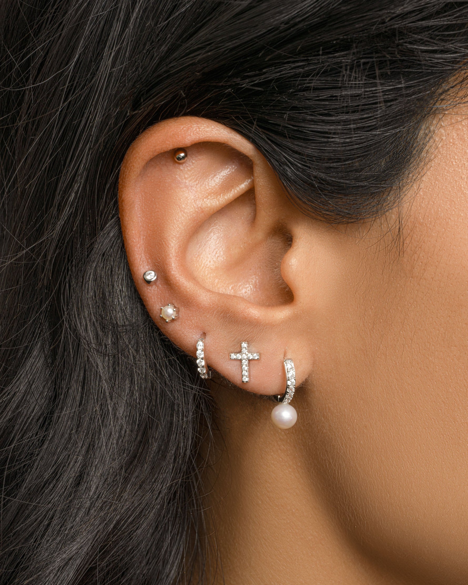 Sterling silver Tiny Cross Stud Earrings by Sami Jewels, featuring small cross design perfect for everyday wear.