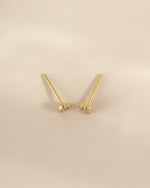 Gold Tiny Heart CZ Stud Earrings by Sami Jewels, small heart-shaped sparkling cubic zirconia studs viewed from above.