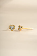 Gold Tiny Heart CZ Stud Earrings by Sami Jewels featuring sparkling cubic zirconia heart charms for a delicate, elegant look.