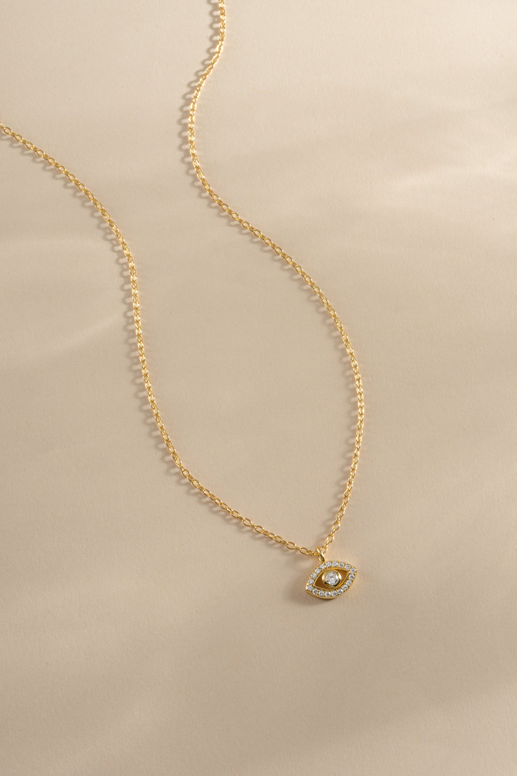 Gold Tiny Evil Eye Necklace by Sami Jewels, front view showing delicate evil eye pendant on a fine chain.