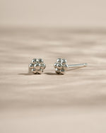 Sterling silver tiny flower stud earrings by Sami Jewels, featuring delicate floral design perfect for everyday wear.