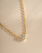 Close-up of Sami Jewels' gold tiny heart necklace showing delicate chain and small heart pendant.