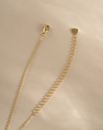 Gold Tiny Heart Necklace by Sami Jewels featuring a delicate heart pendant with a lobster clasp.