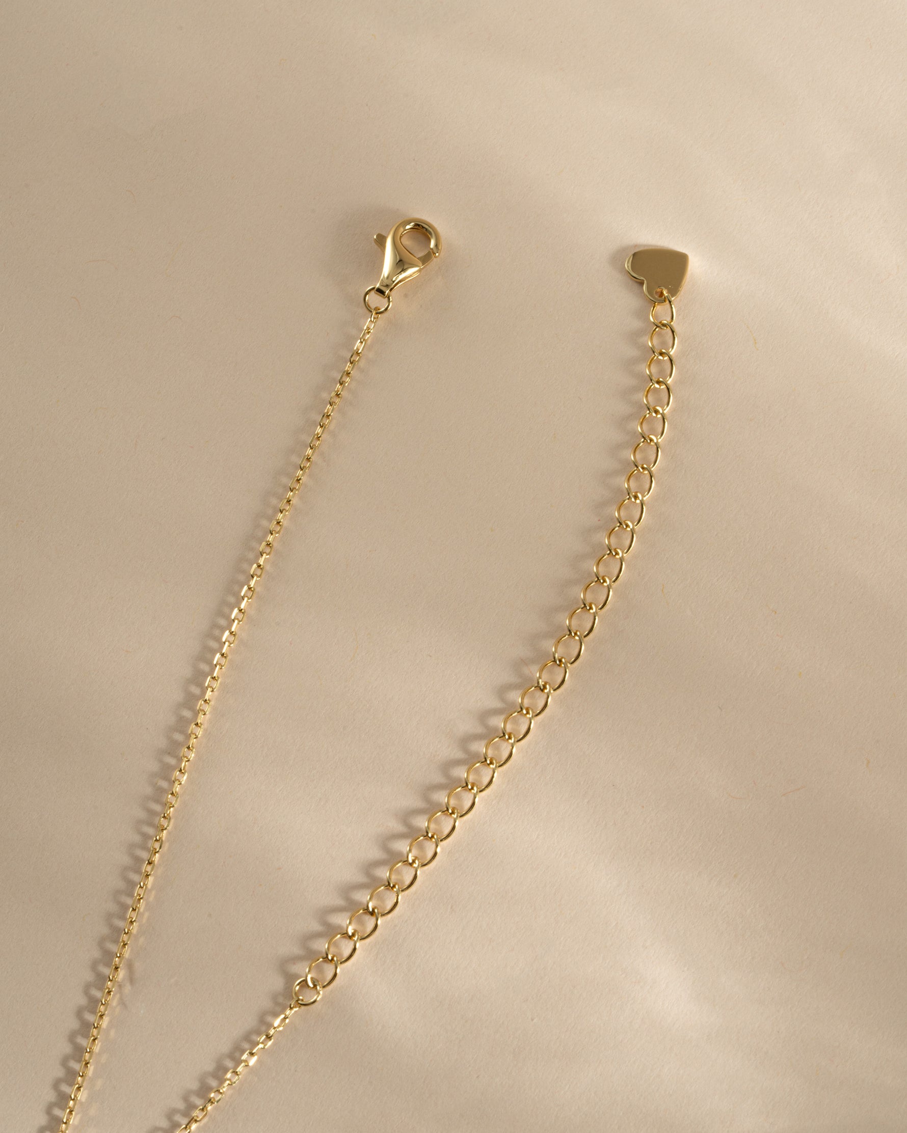 Gold Tiny Heart Necklace by Sami Jewels featuring a delicate heart pendant with a lobster clasp.