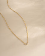 Gold Tiny Heart Necklace from Sami Jewels featuring a delicate heart pendant on a fine chain.