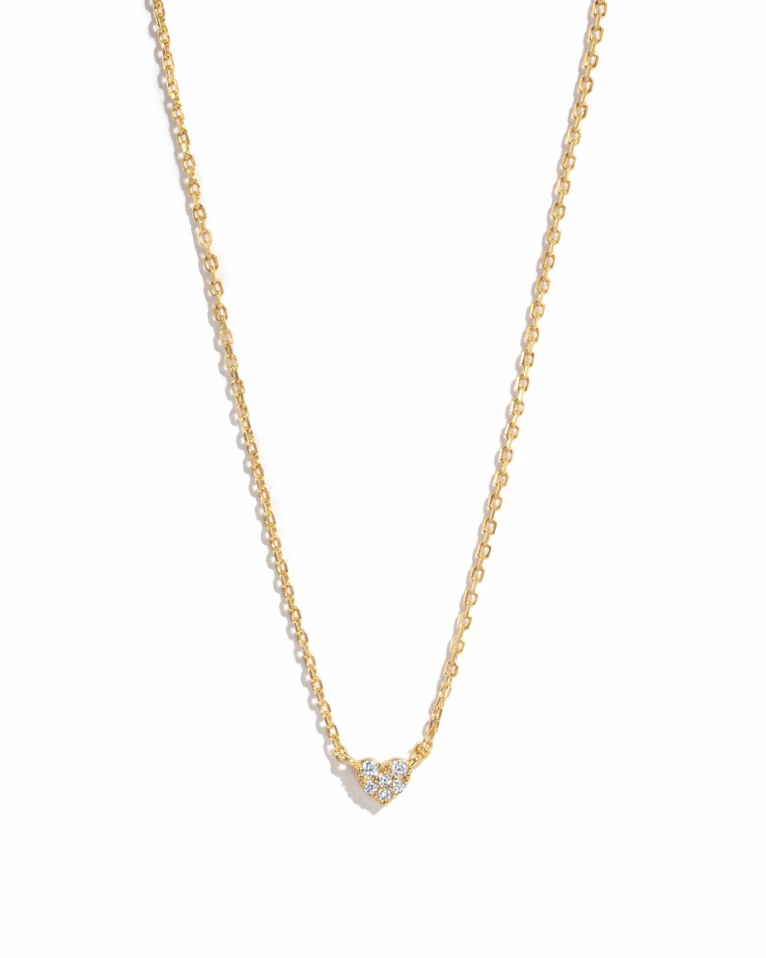 Gold Tiny Heart Necklace from Sami Jewels, featuring a delicate heart pendant on a fine chain, displayed against a white background.