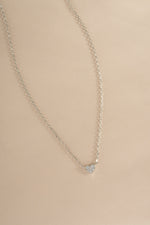 Sterling silver Tiny Heart Necklace from Sami Jewels showing a delicate heart pendant on a chain.