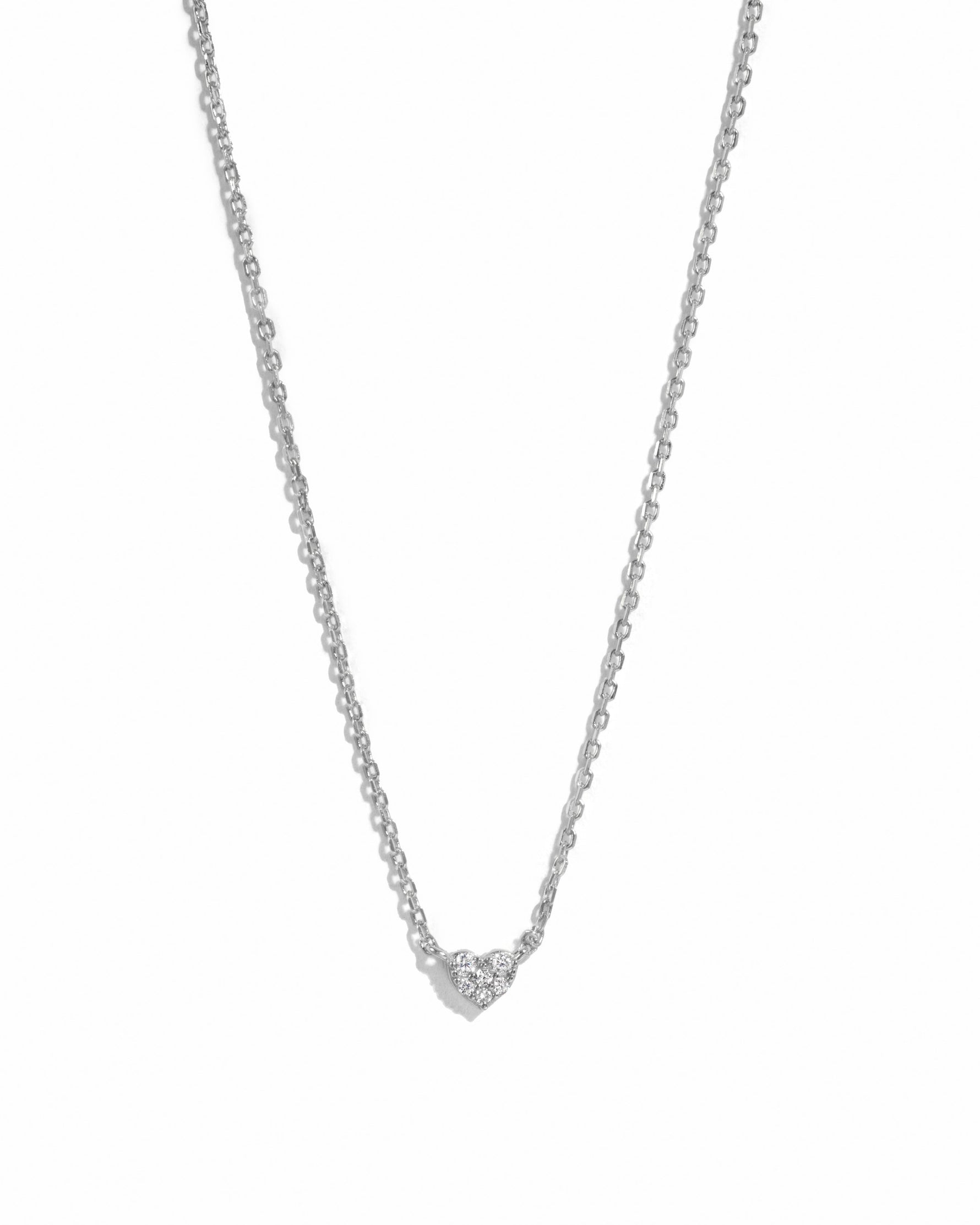 Sterling silver Tiny Heart Necklace from Sami Jewels featuring a delicate heart pendant on a fine chain.
