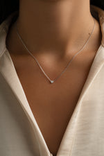 Sterling silver Tiny Heart Necklace with delicate heart pendant, stylish jewelry by Sami Jewels.