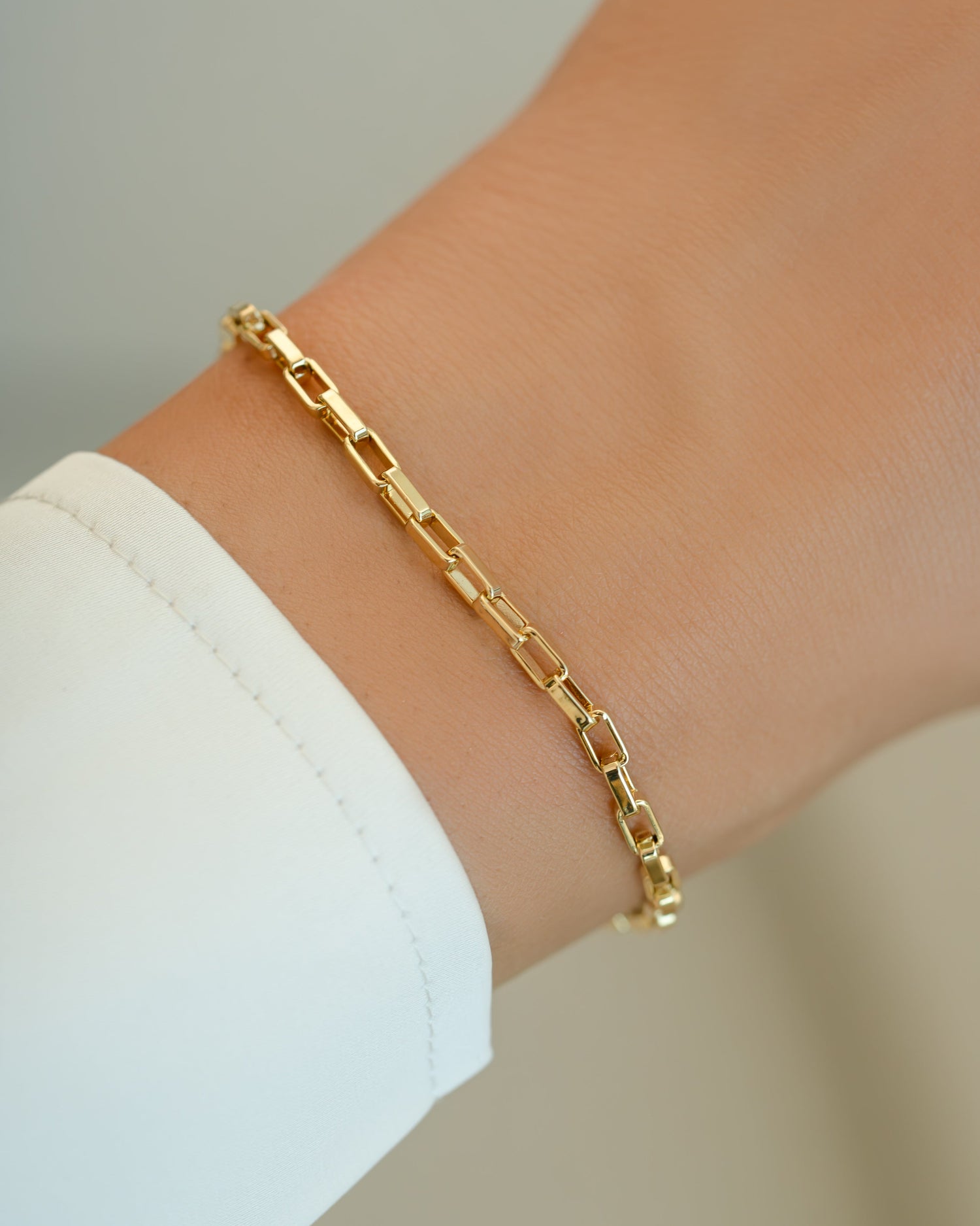 Gold Tiny Link Paperclip Bracelet by Sami Jewels featuring sleek interconnected paperclip chain design.
