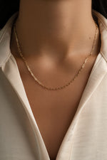 Gold Tiny Link Paperclip Necklace by Sami Jewels featuring a sleek chain design with small interconnected links.