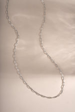 Sterling silver Tiny Link Paperclip Necklace by Sami Jewels, close-up of delicate chain with small paperclip links.