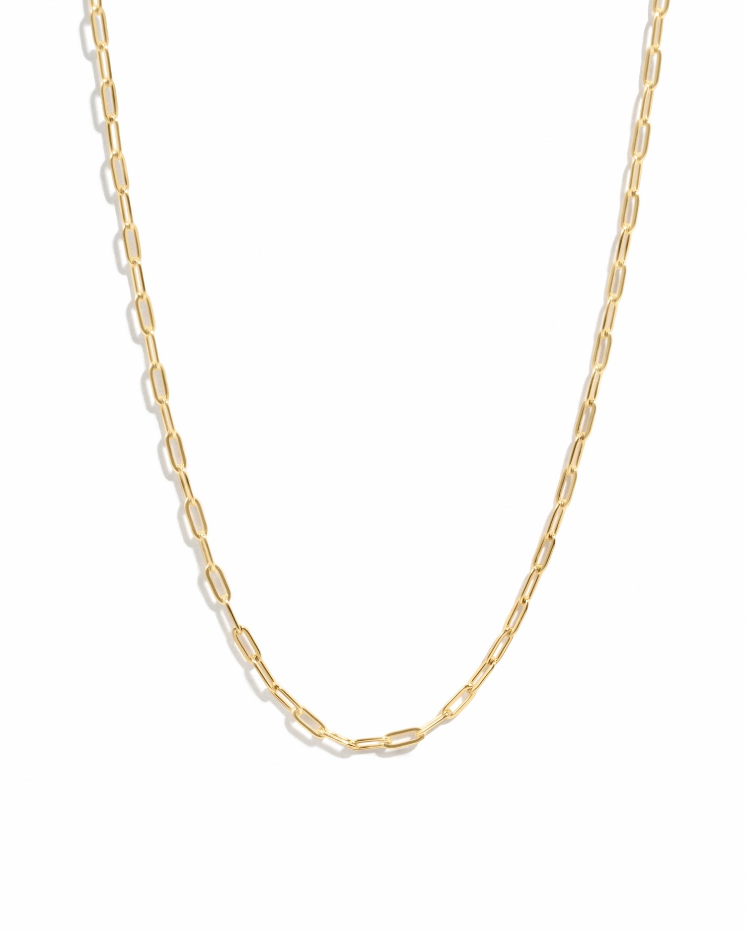 Gold Tiny Link Paperclip Necklace by Sami Jewels, showcasing a sleek, minimalist paperclip chain on a white background.
