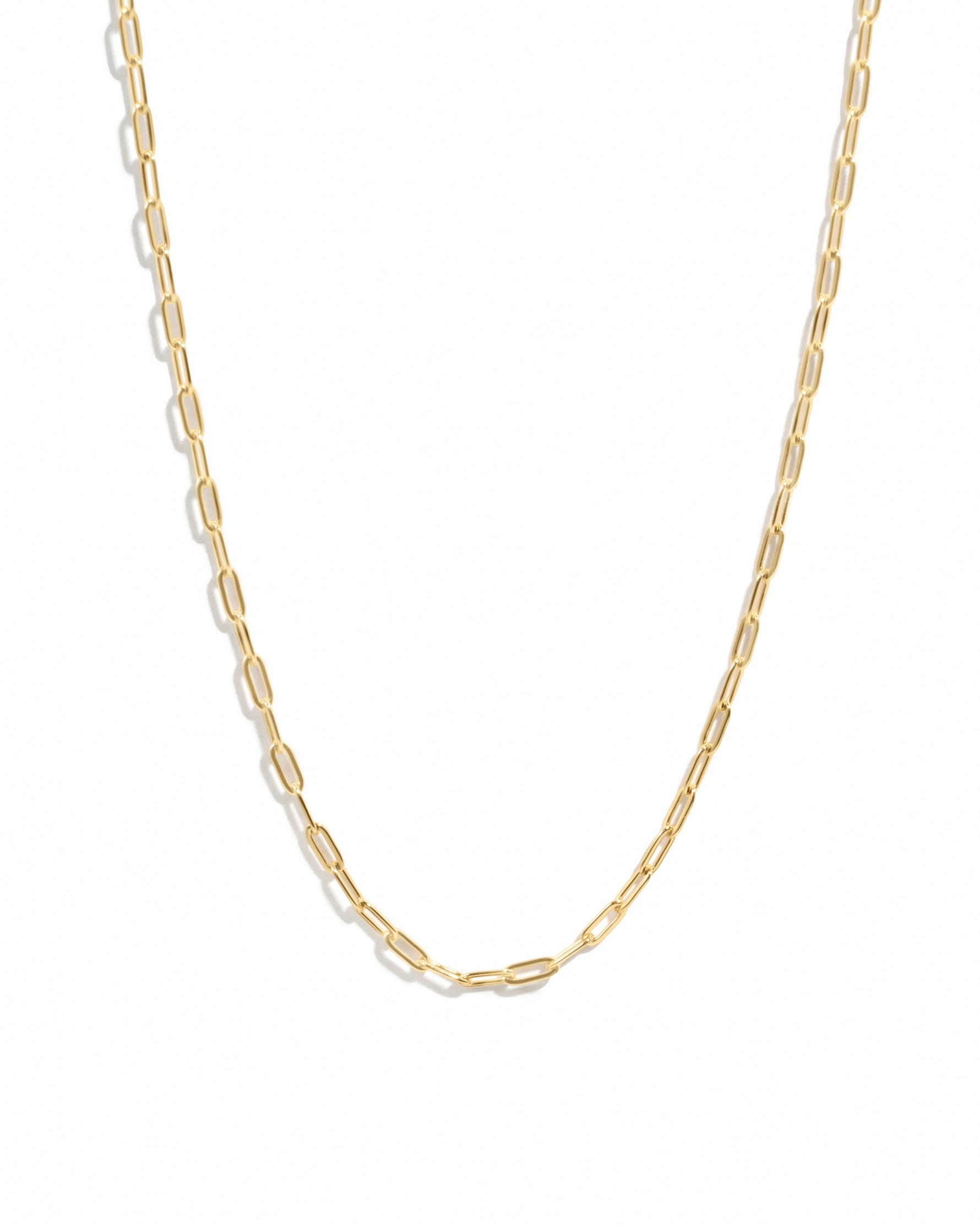 Gold Tiny Link Paperclip Necklace by Sami Jewels, showcasing a sleek, minimalist paperclip chain on a white background.