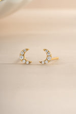 Gold Tiny Moon Stud Earrings by Sami Jewels, close-up front view showing small crescent moon design in polished gold finish.
