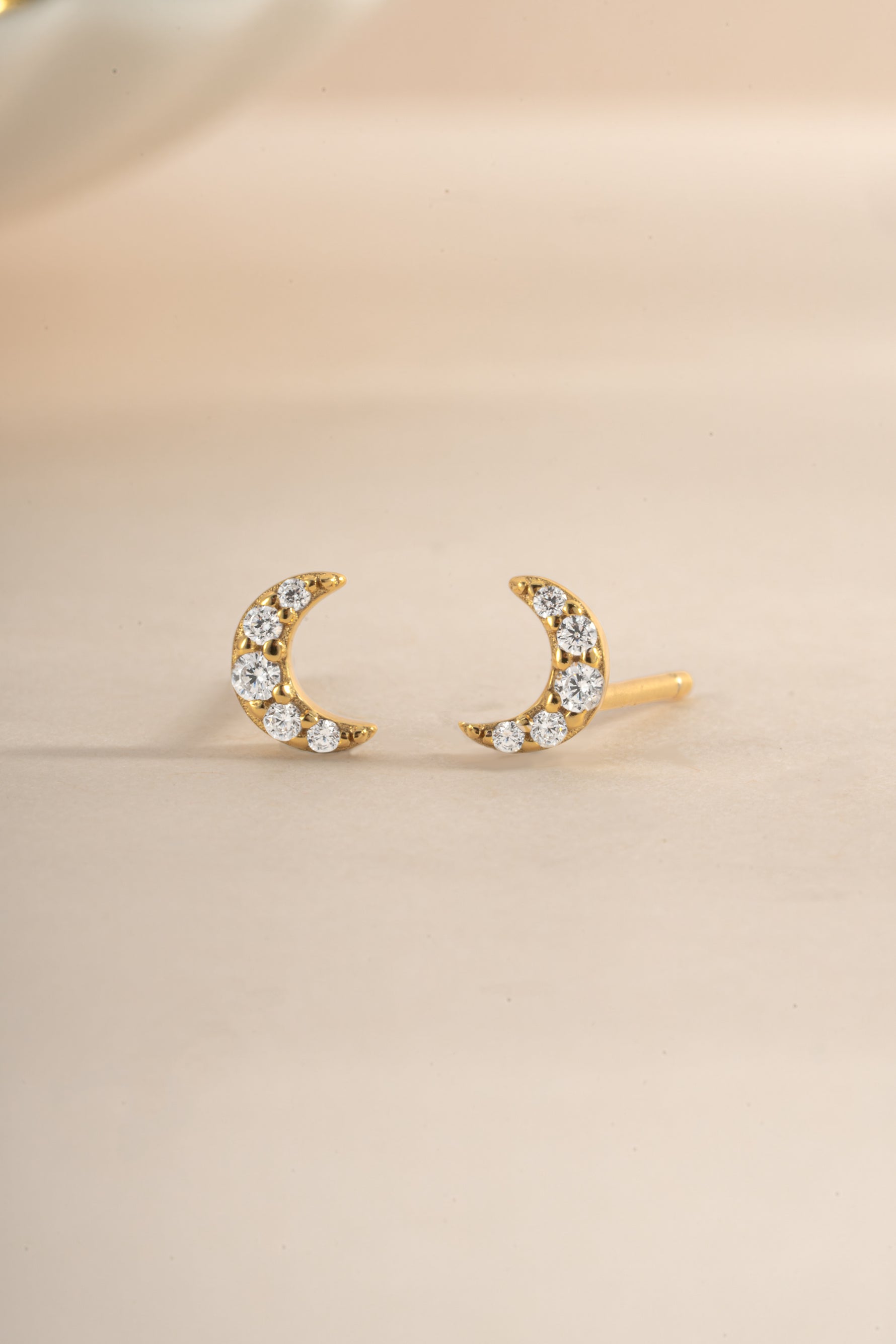 Gold Tiny Moon Stud Earrings by Sami Jewels, close-up front view showing small crescent moon design in polished gold finish.