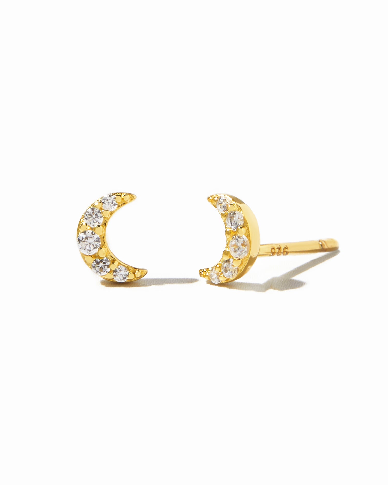 Gold Tiny Moon Stud Earrings by Sami Jewels, featuring small moon-shaped designs on a white background.