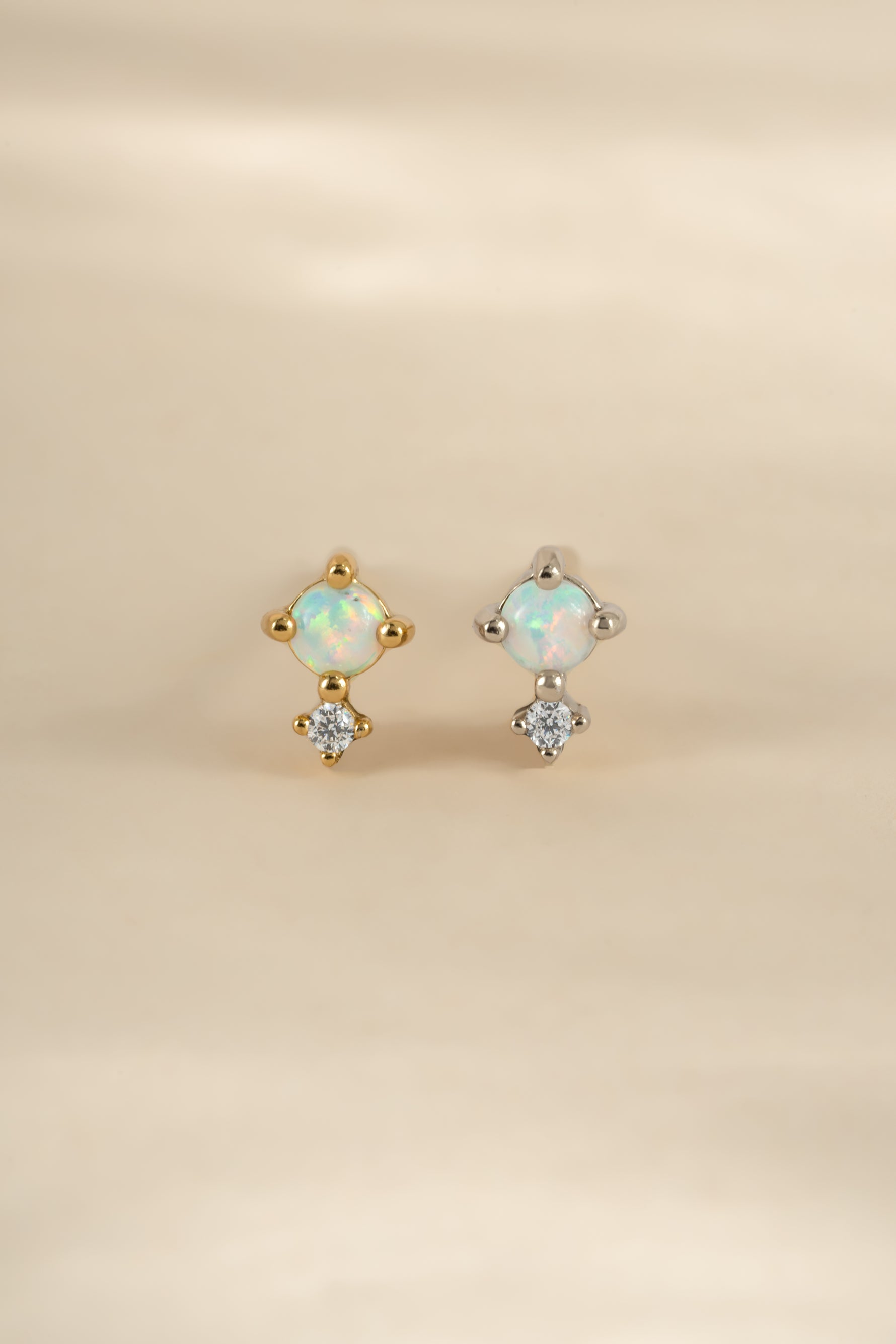 Sterling silver and gold tiny opal stud earrings by Sami Jewels, featuring small, iridescent opal gemstone studs.