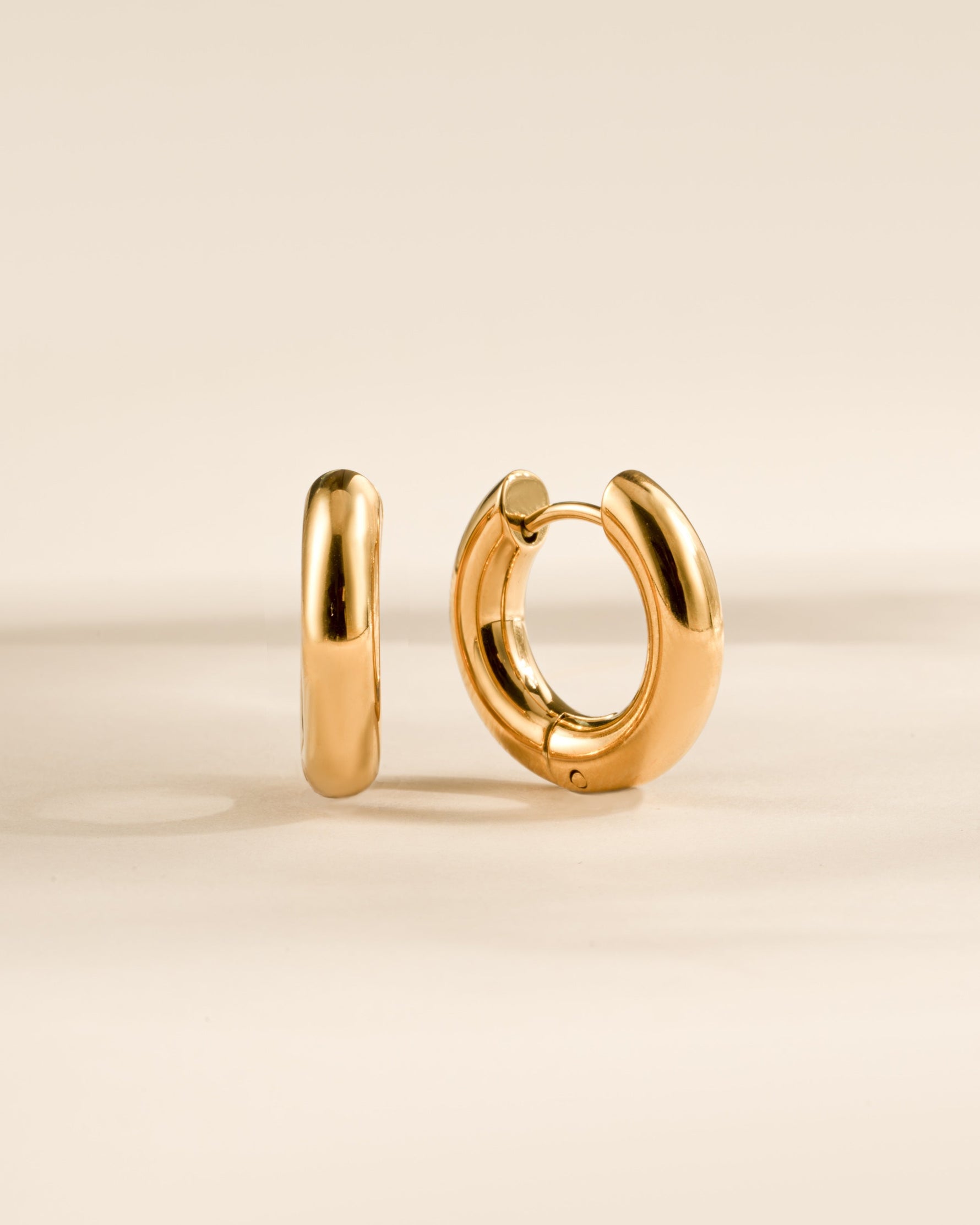 Gold stainless steel SS Thick Tube Hoop Earrings by Sami Jewels, close-up view showing smooth, waterproof design.
