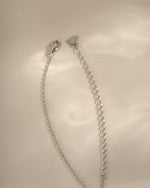 Turquoise and cubic zirconia dangling charm necklace by Sami Jewels featuring sterling silver and lobster clasp closure.