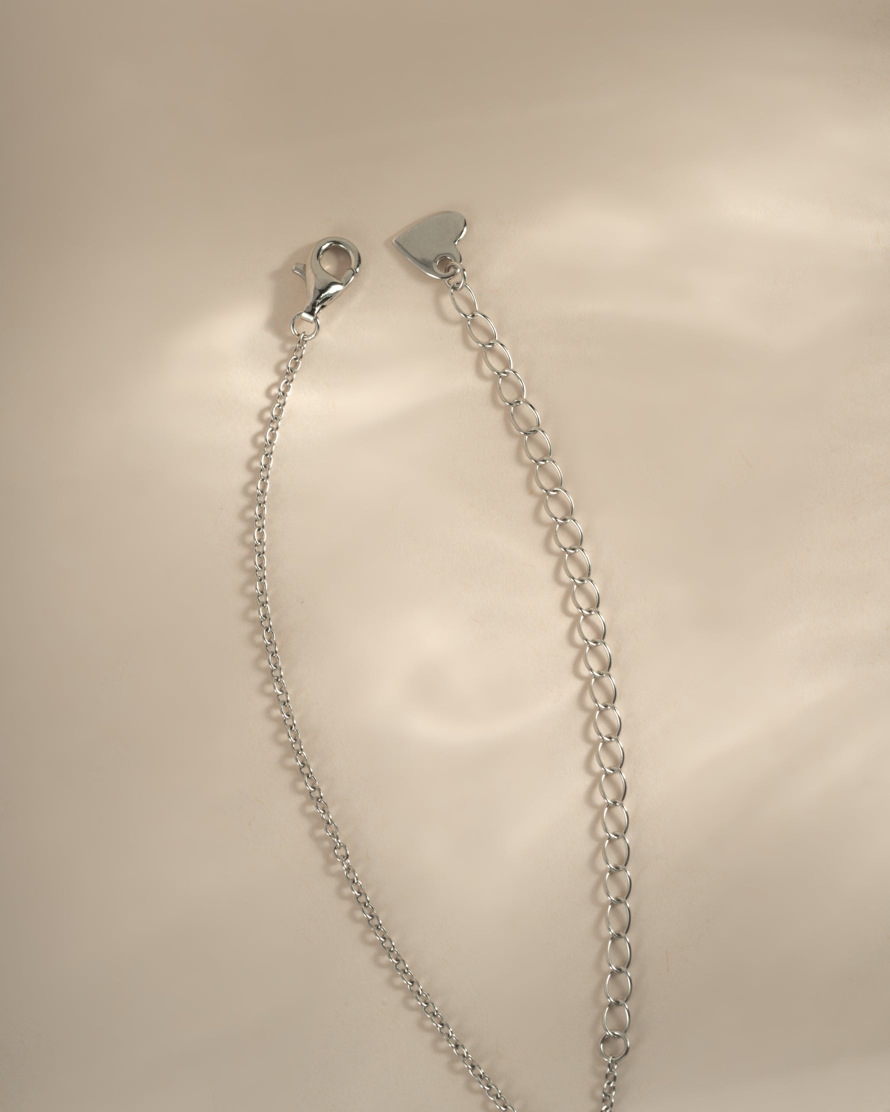 Turquoise and cubic zirconia dangling charm necklace by Sami Jewels featuring sterling silver and lobster clasp closure.