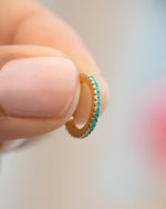 Close-up of Sami Jewels turquoise ear cuff, stylish ear jewelry featuring vibrant turquoise stone and unique cuff design.