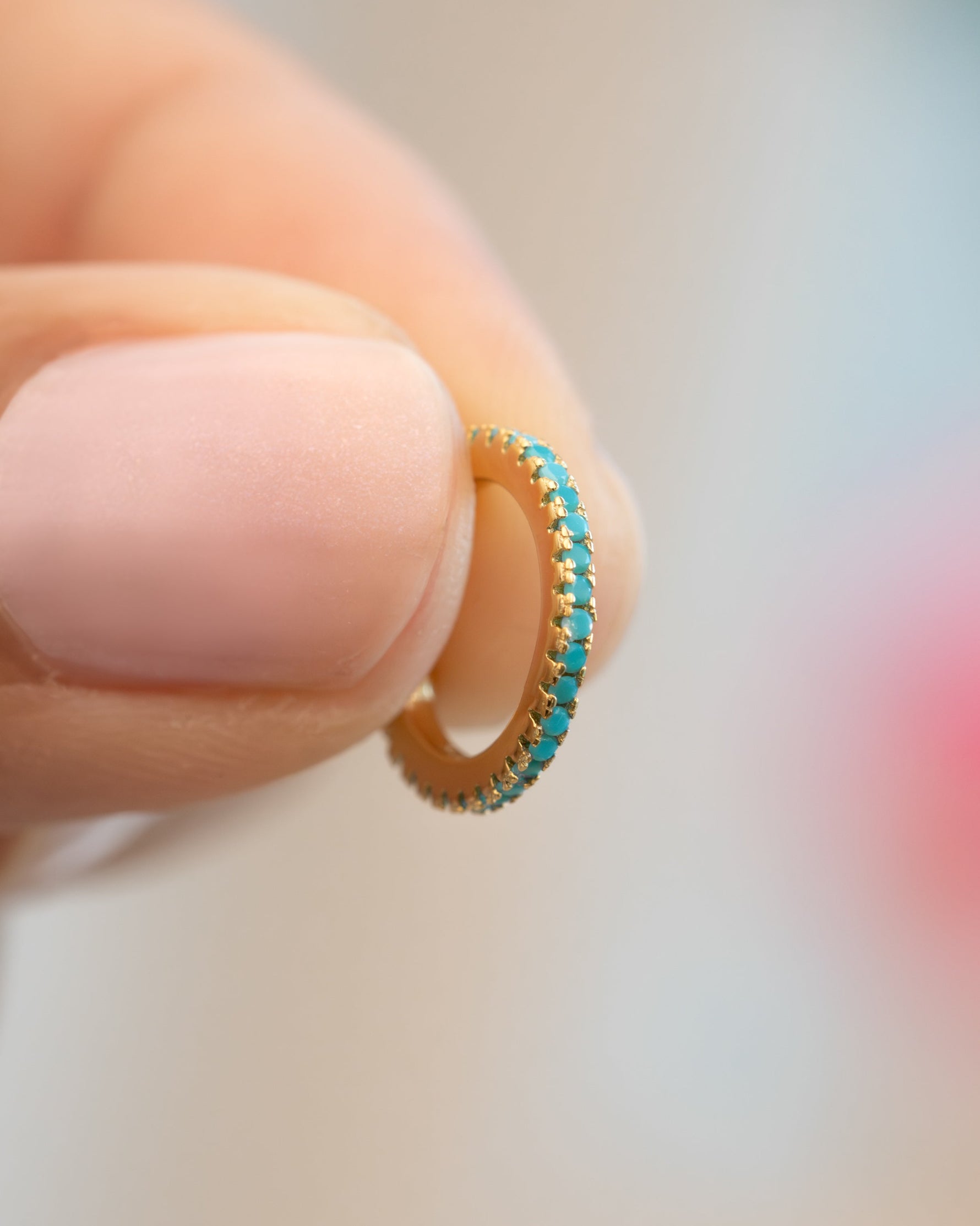 Close-up of Sami Jewels turquoise ear cuff, stylish ear jewelry featuring vibrant turquoise stone and unique cuff design.