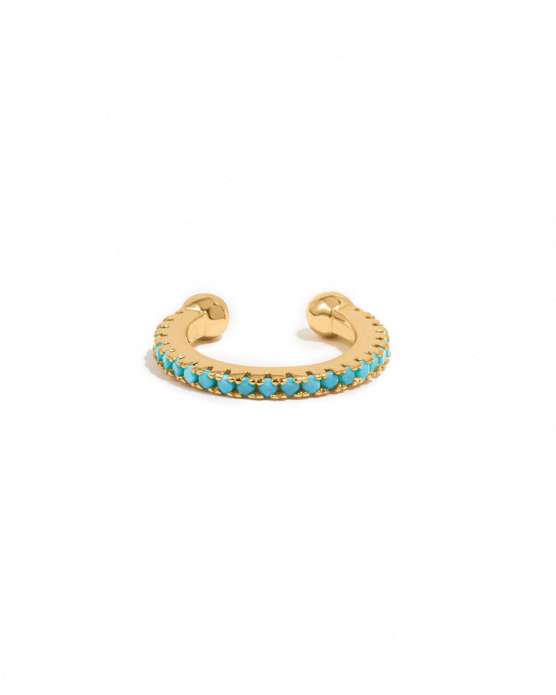 Gold turquoise ear cuff earrings by Sami Jewels, featuring vibrant turquoise stones on a white background.
