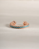 Turquoise ear cuff earrings by Sami Jewels in rose gold with a sleek, modern design and vibrant turquoise gemstone accents.