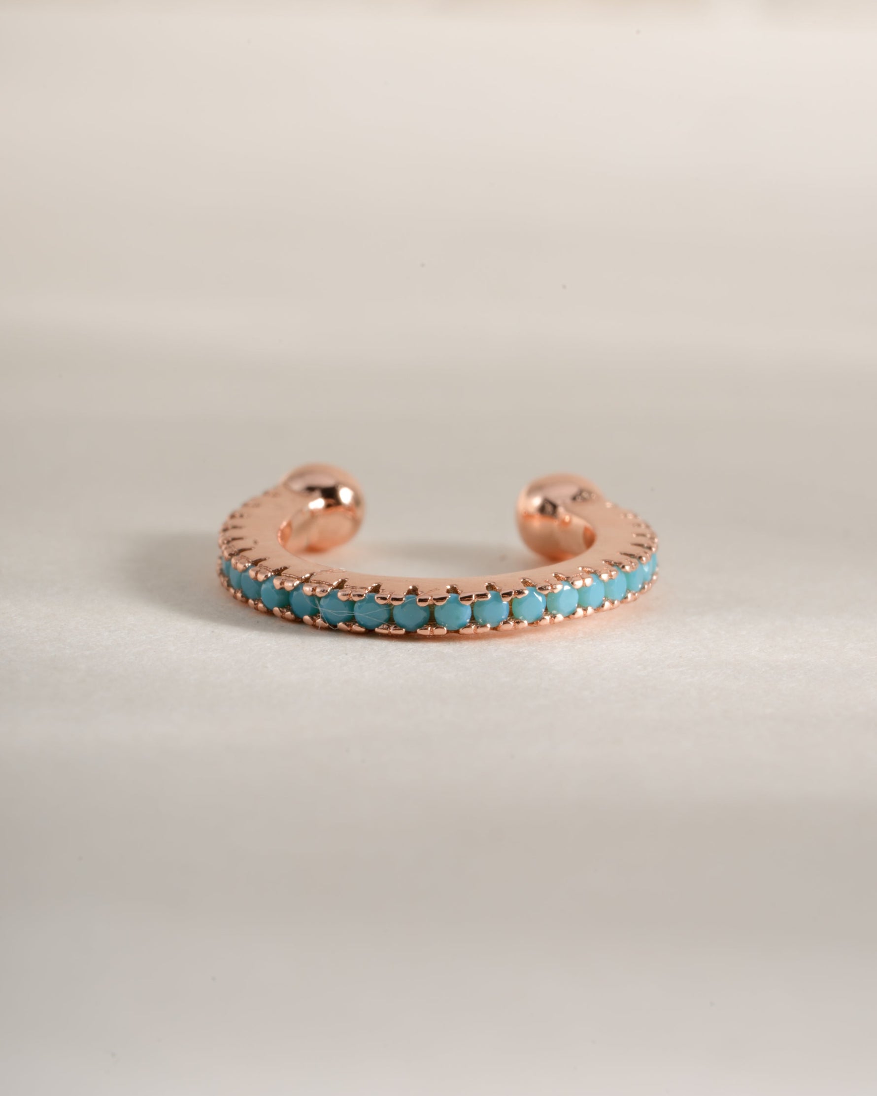 Turquoise ear cuff earrings by Sami Jewels in rose gold with a sleek, modern design and vibrant turquoise gemstone accents.