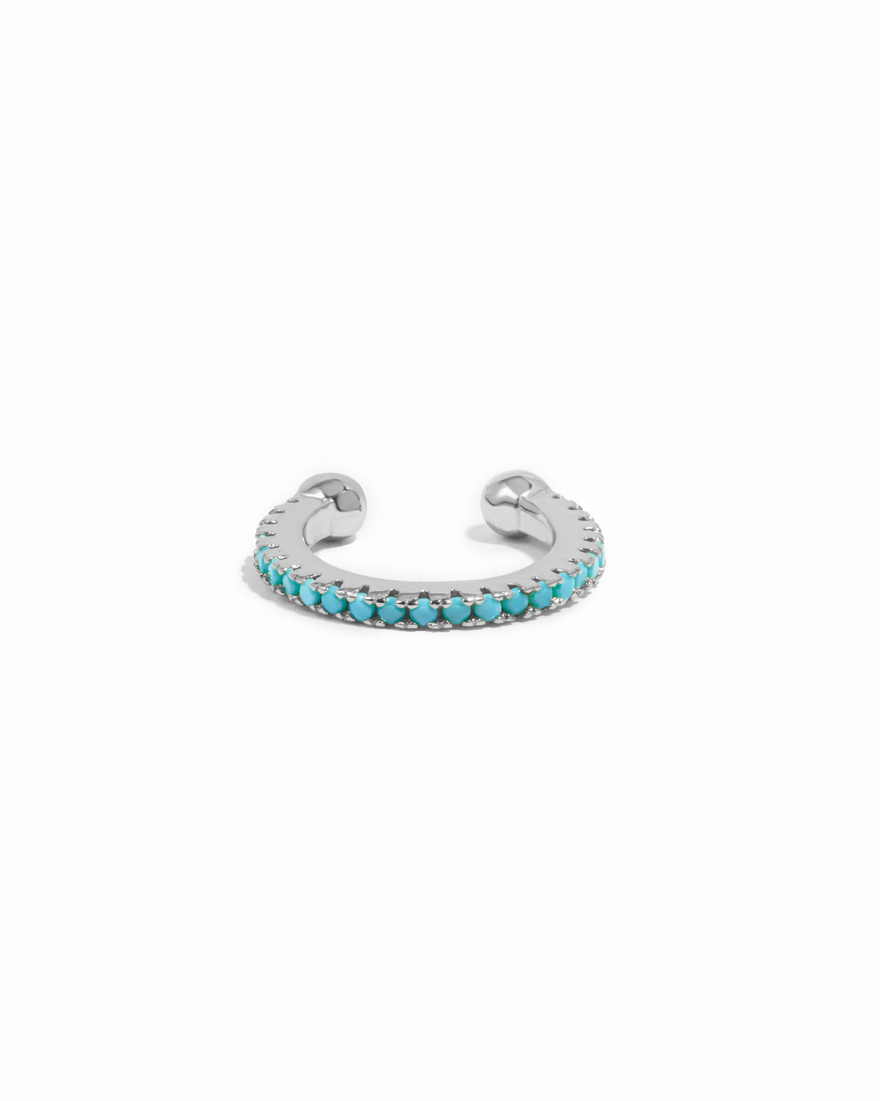 Turquoise ear cuff earrings by Sami Jewels featuring sterling silver design on a white background.