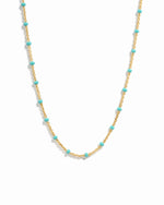 Turquoise enamel beaded necklace by Sami Jewels featuring vibrant blue beads on a gold chain.