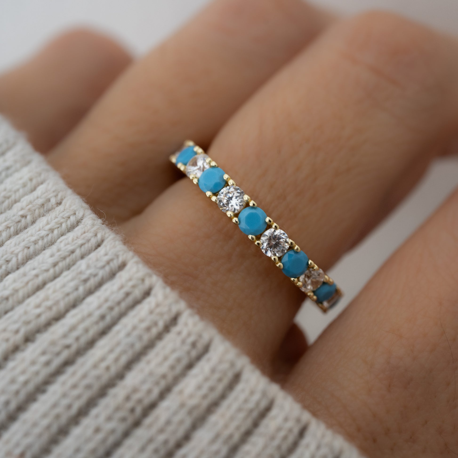 alternating turquoise and cz ring on a model 