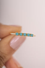 Close-up of Sami Jewels 5 Stone Turquoise Ring showing gold band and vibrant turquoise stones set in a stylish ring.