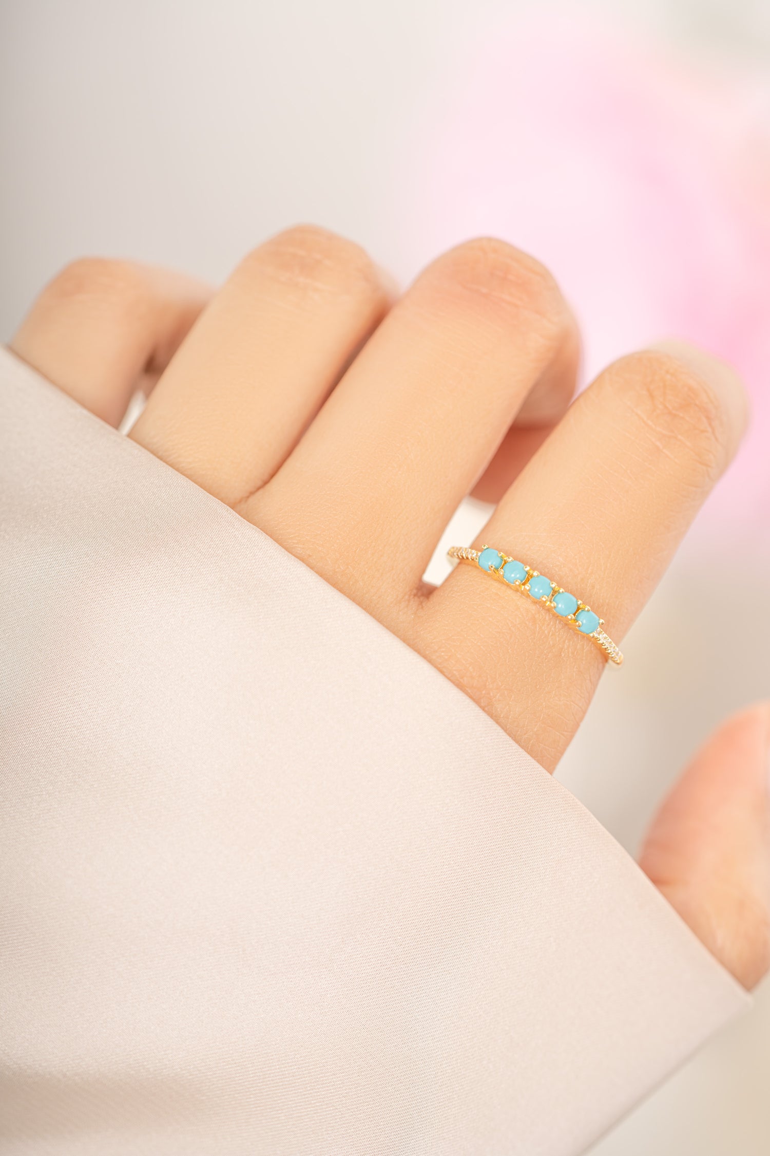 Gold 5-stone turquoise ring by Sami Jewels featuring vibrant turquoise stones set in a stylish ring design.