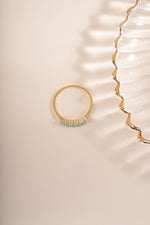 Gold 5 stone turquoise ring by Sami Jewels, featuring five vibrant turquoise stones set in a stylish ring design.