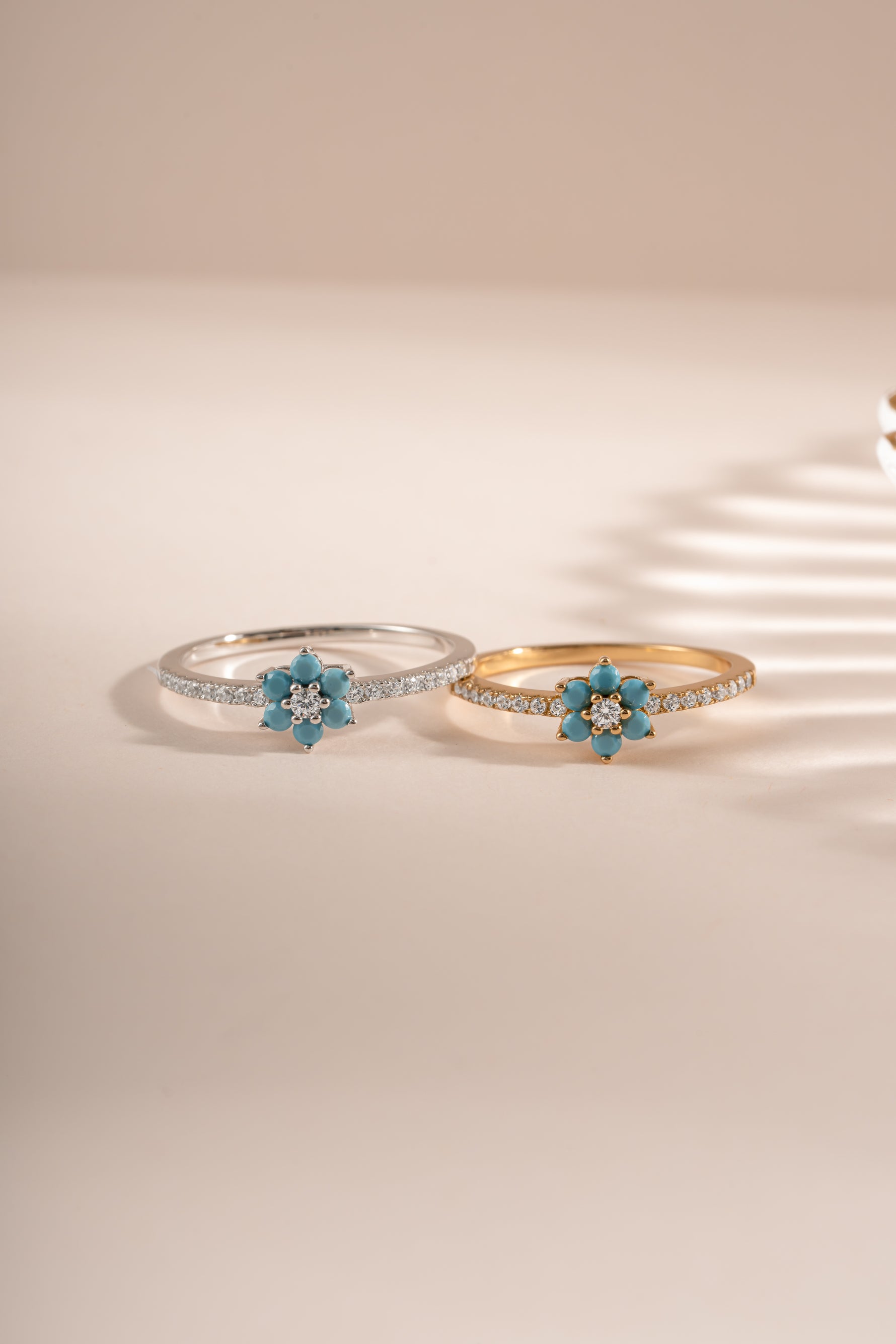 Turquoise flower ring by Sami Jewels featuring gold and sterling silver band, with a detailed turquoise flower design.