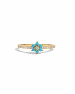 Gold Sami Jewels turquoise flower ring with intricate floral design on a white background