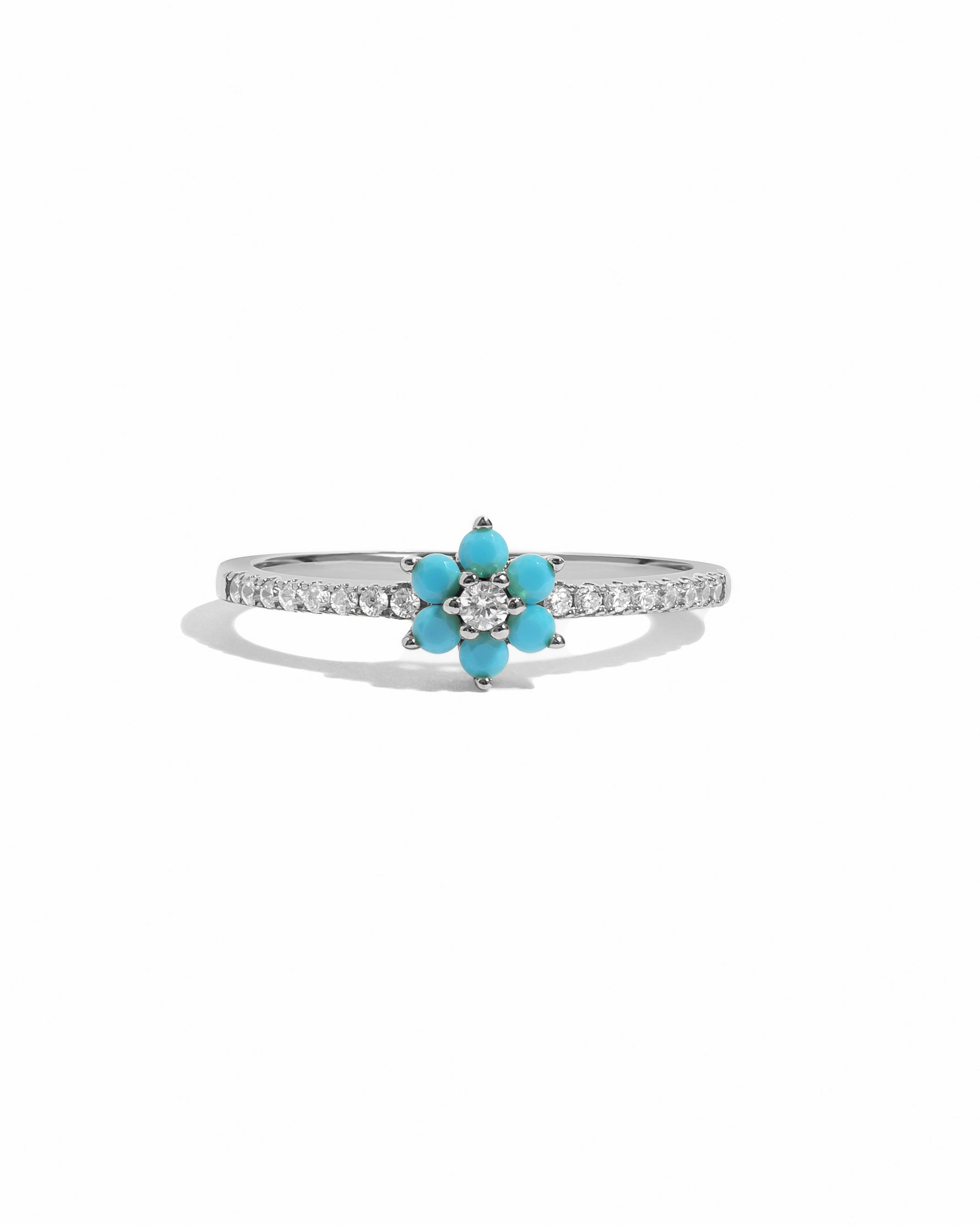 Sterling silver turquoise flower ring from Sami Jewels with intricate floral design on a white background.
