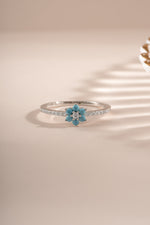 Sterling silver turquoise flower ring by Sami Jewels featuring a vibrant turquoise flower design on a polished silver band.