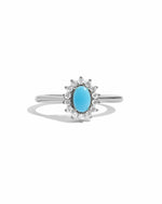 Sami Jewels Layla turquoise oval halo ring with sterling silver band on a white background.