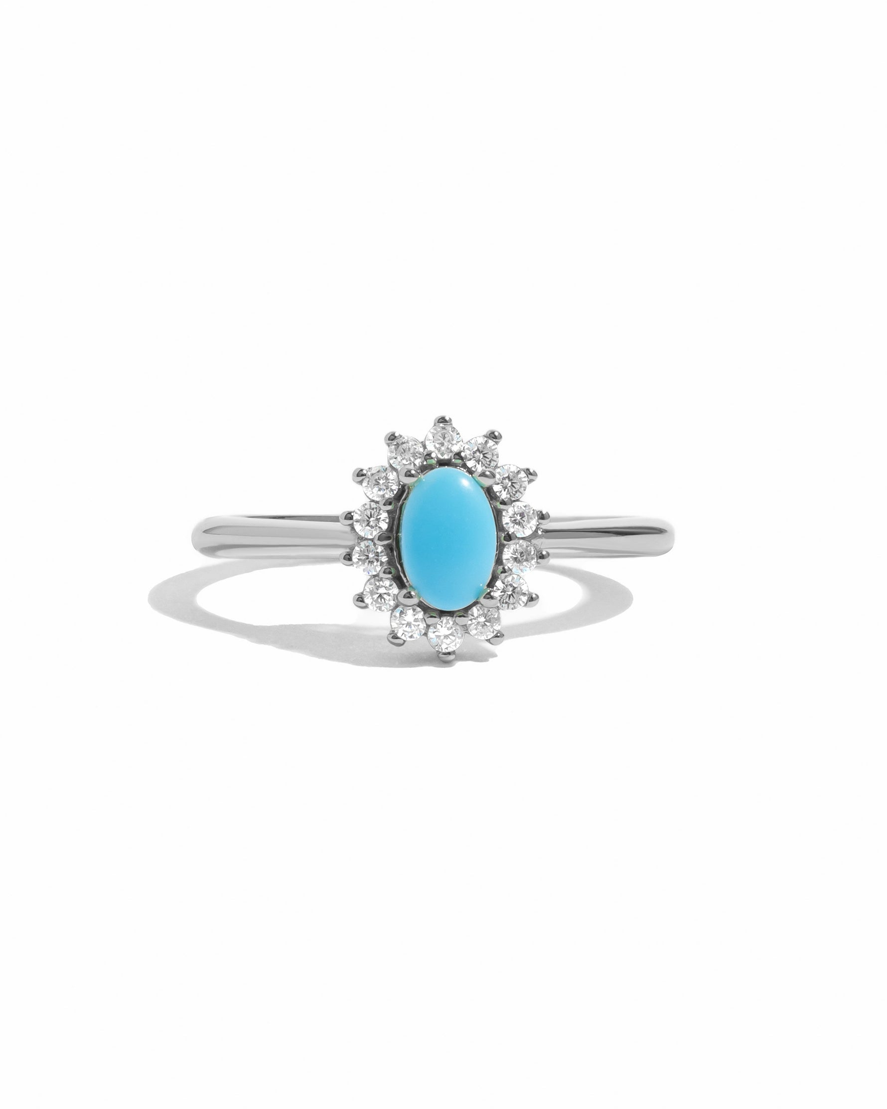 Sami Jewels Layla turquoise oval halo ring with sterling silver band on a white background.
